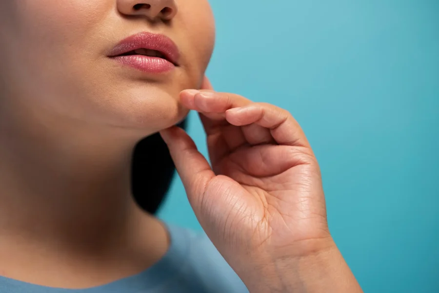 woman touching her face